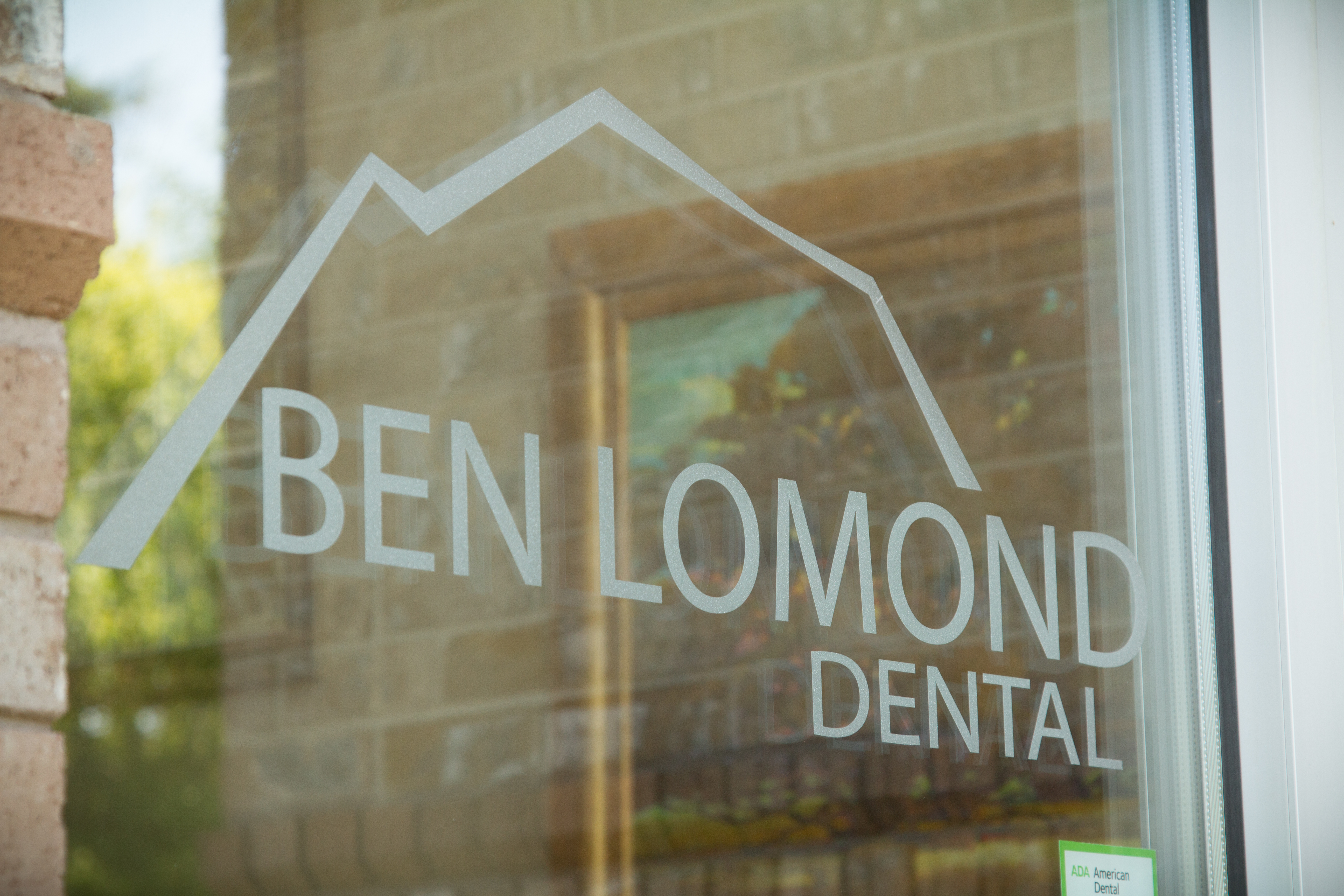Ben Lomond Dental logo on glass door services